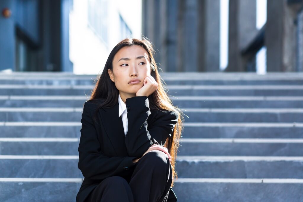 Woman wondering if shooting corporate videos is going to be too expensive and tedious.